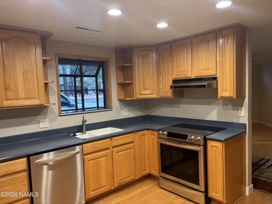 Fantastic golf course location home. Cedar siding and rock