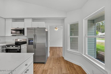 LIKE NEW and completely renovated from top to bottom, this - photo 11