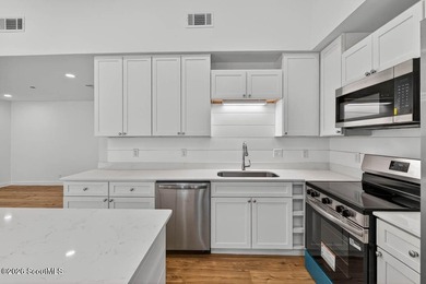 LIKE NEW and completely renovated from top to bottom, this - photo 12