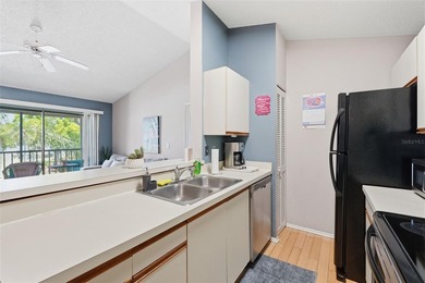 This bright and inviting 3rd-floor corner condo in coveted - photo 9
