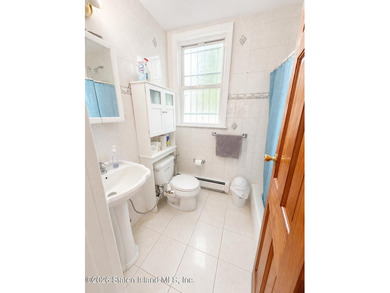 Opportunity to own legal 2 family with full finished basement - photo 7