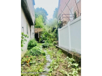 An opportunity to own a vintage street-to-street property on a - photo 5