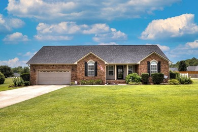 Welcome home to this beautifully landscaped brick home offering - photo 1