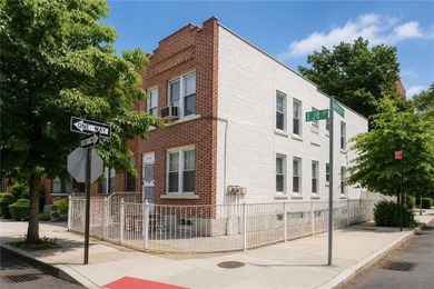 Solid brick 2 family corner home. First floor features formal - photo 1