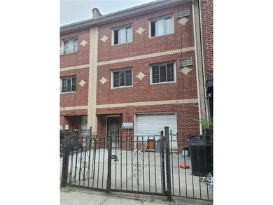 Welcome to this Move-In Ready Three Family Home Located in the - photo 1