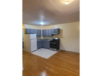 Welcome to this Move-In Ready Three Family Home Located in the - photo 3