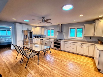 Lake life just got an upgrade. This remodeled waterfront home at - photo 3