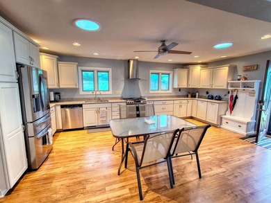 Lake life just got an upgrade. This remodeled waterfront home at - photo 4