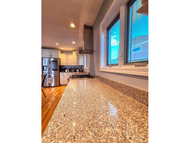 Lake life just got an upgrade. This remodeled waterfront home at - photo 5