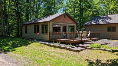 Escape to this charming four-season cabin on highly sought-after - photo 2