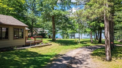 Escape to this charming four-season cabin on highly sought-after - photo 3