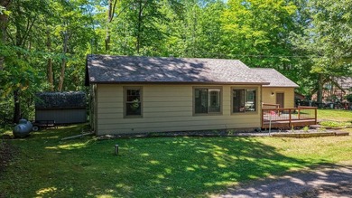 Escape to this charming four-season cabin on highly sought-after - photo 4