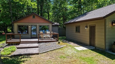 Escape to this charming four-season cabin on highly sought-after - photo 6