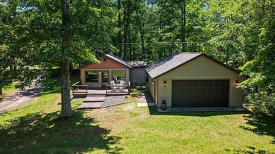 Escape to this charming four-season cabin on highly sought-after - photo 8