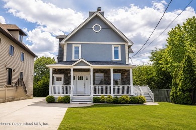 Welcome to 5434 Amboy Road - an exceptional legal two-family - photo 1
