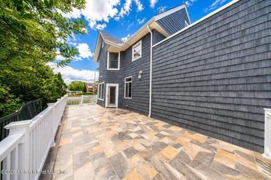 Welcome to 5434 Amboy Road - an exceptional legal two-family - photo 10