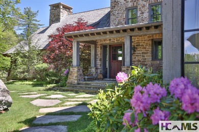 Nestled within the prestigious Mountaintop Golf & Lake Club in - photo 3