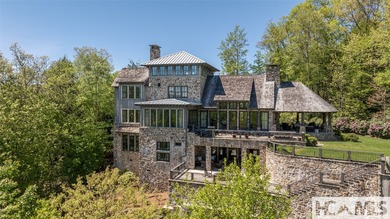 Nestled within the prestigious Mountaintop Golf & Lake Club in - photo 4