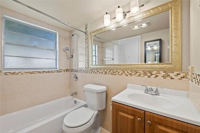 Spacious 1-bedroom, 1.5-bathroom condo conveniently located on - photo 12