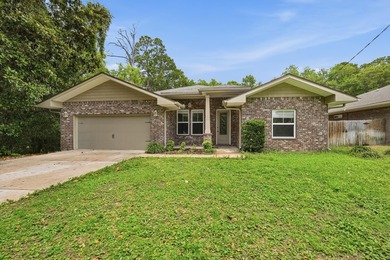 Beautifully maintained 4-bedroom, 3-bath brick home tucked away - photo 1
