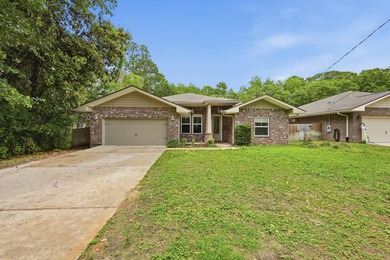 Beautifully maintained 4-bedroom, 3-bath brick home tucked away - photo 2