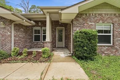 Beautifully maintained 4-bedroom, 3-bath brick home tucked away - photo 3