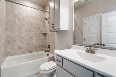 This jewel in the gated Merion community offers refined