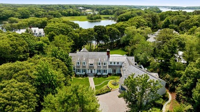 This meticulously renovated waterfront Cape on the bay is - photo 1