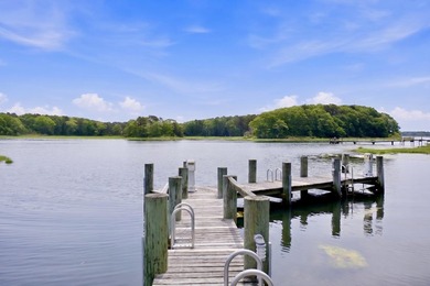This meticulously renovated waterfront Cape on the bay is - photo 2