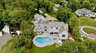 This meticulously renovated waterfront Cape on the bay is - photo 3