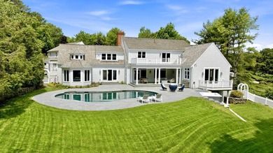 This meticulously renovated waterfront Cape on the bay is - photo 4