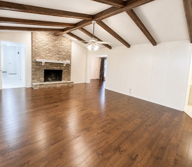 Nestled on a beautifully landscaped corner lot in the - photo 3
