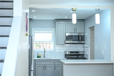 Welcome Home! Two Story, Three Level Row-House That Offers Three - photo 4