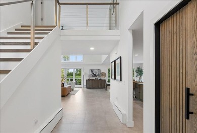 Discover refined coastal living in this beautifully renovated - photo 15