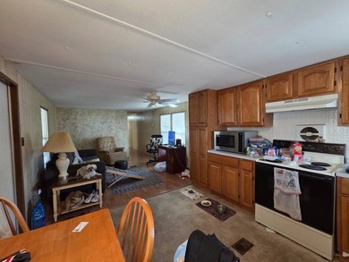 This 2 bed 1 bath home is located in Orangewood Lakes MHC a 55+ - photo 3