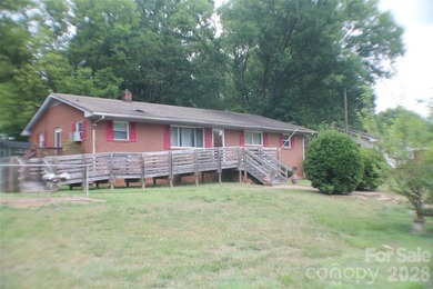 Discover a Rare Diamond in the Rough in Davidson, NC! Nestled on - photo 2