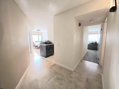 Exquisitely renovated corner residence offering 1,129 sq ft of