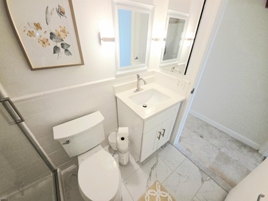 Exquisitely renovated corner residence offering 1,129 sq ft of