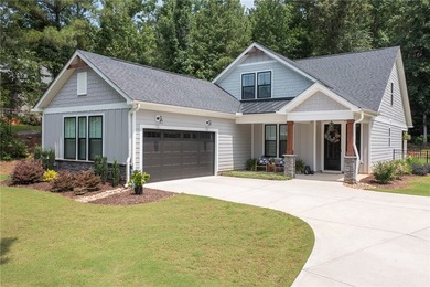 Come home to 1111 Bay Drive in Treasure Bay, a like-new 2023 - photo 1