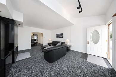 Welcome to this semi-attached two-family home located in the - photo 3