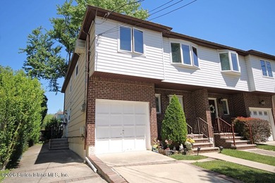 Excellent opportunity to own a 2-family semi-attached home in a - photo 2