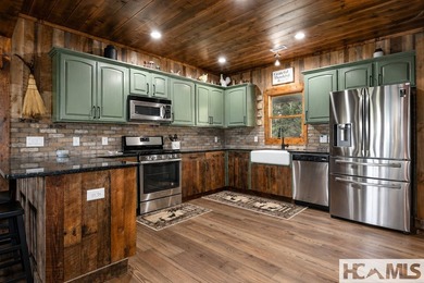 Nestled among the trees with sweeping mountain views, this - photo 3