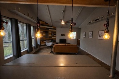 Set on nearly an acre of land, this one-of-a-kind property - photo 4