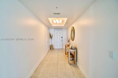 Located in the prestigious Hidden Bay Condo, this stunning - photo 2