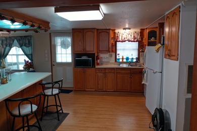 75 acres with a well maintained 3 Bedroom 2 Bath manufactured