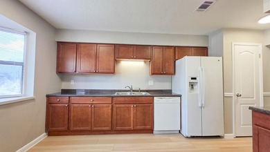 Freshly updated townhome, WITH A BRAND NEW ROOF in 2026. This - photo 2