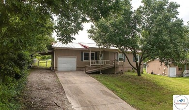 4-bed, 2-bath home in Warsaw featuring an open floor plan - photo 1