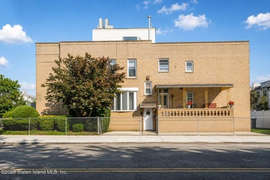 Welcome to this solid brick 5/5 two-family semi-attached home - photo 2