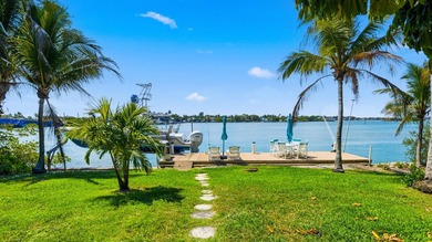 Discover Your Hidden Paradise! This charming riverfront property - photo 2
