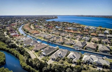 This spectacular Neal Signature home is a boater's dream! Built - photo 1